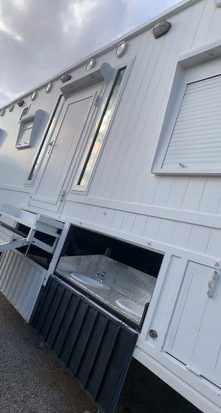 White Metallic Trailer with Built-in Bathroom Features