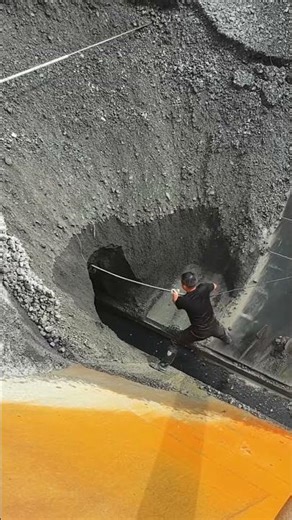 The process of unloading ore from the ship