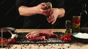 The chef prepares a meal of beef and vegetables in a professional kitchen. Cooking a steak. The concept of tasty and healthy food. 4k footage Stock Video