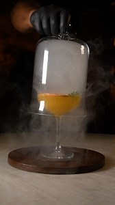 A tequila-based tropical cocktail, decorated with dehydrated grapefruit and smoke. Are you looking for a unique experience full of mysticism? Book your table and immerse yourself in Alux. #AluxRestaurant #AluxPlayaDelCarmen #RestaurantesPlayaDelCarmen #TurismoPlayaDelCarmen #Playadelcarmenrestaurants | ALUX - Fine Dining - Playa del Carmen