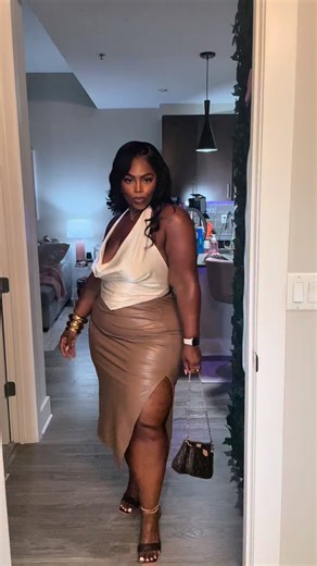 Nessa Sherysse on Instagram: "Juicy (adj.) for a woman: 💋 moisturized 🍑 curvy 💦 feminine 💄 luxe 🌸 abundant 🧴 soft but not silent 👜 expensive in energy 👃🏾 unforgettable in scent 🖤 never dry in vibe @fashionnovacurve Cara Satin Cowl Neck Halter Top — XL By The Corner Faux Leather Midi Skirt — 1X No Competition Heeled Sandals — 10 Comment Shop for the 🔗s #fashionnovacurve #fashionnova #luxurybaddie #atlantacreator #plussizestyle #plussizecreator #plussizefashion #curvyinspo #trendybaddie