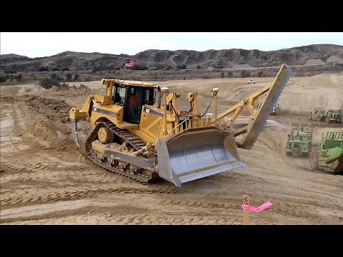 CAT D8T Dozer and TEREX TS-24B Scrapers moving dirt. Massive work site