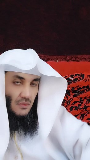 Stylish White Garment with Unique Black and Red Pattern