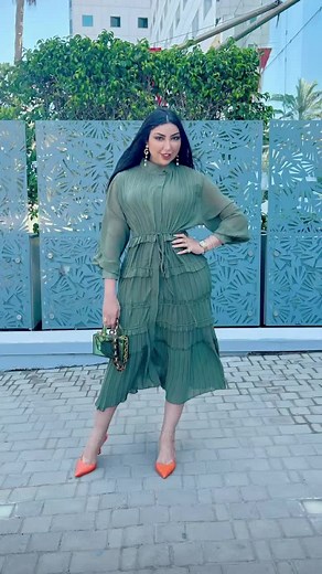 Stylish Urban Fashion in Green Dress and Accessories