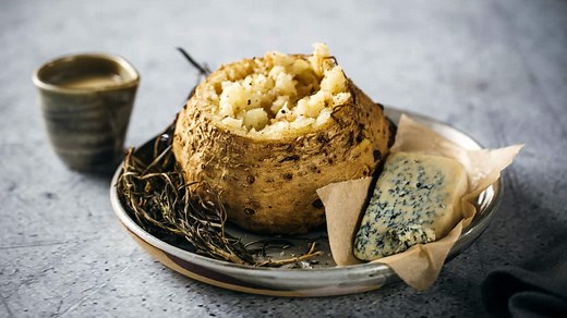Whole roasted celeriac with velouté and blue cheese