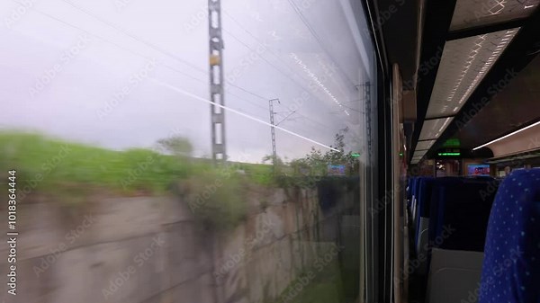 Passenger Train Window View in Motion During Daytime with motion blur