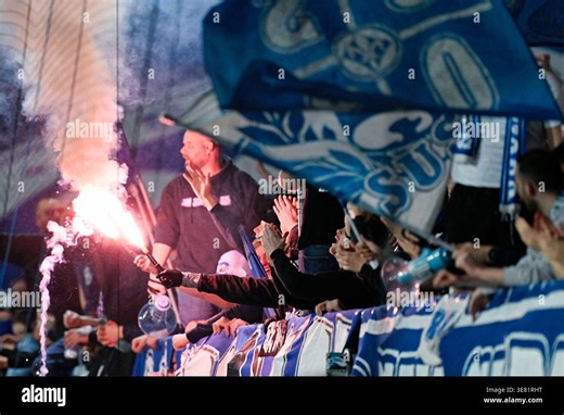 11 April 2026, Hesse, Darmstadt: Soccer, Men: Bundesliga 2, Darmstadt 98 - Hannover 96, Matchday 29, Merck Stadium at Böllenfalltor. Darmstadt fans set off pyrotechnics. Photo: Uwe Anspach/dpa - IMPORTANT NOTE: In accordance with the regulations of the DFL German Football League and the DFB German Football Association, it is prohibited to utilize or have utilized photographs taken in the stadium and/or of the match in the form of sequential images and/or video-like photo series Stock Photo - Ala