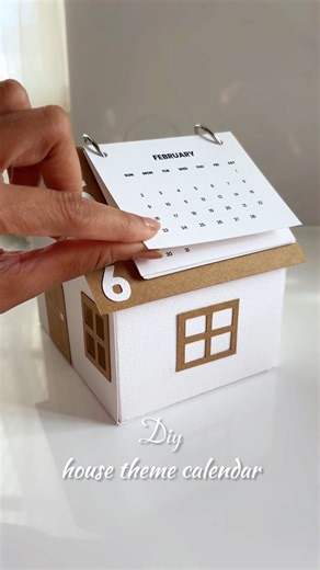 Diy house theme calendar and piggy bank . . watch the full step-by-step tutorial with measurements on my youtube channel! link in bio - don't miss it . . buy my handmade stuff on grify.in . #HandmadeWithLove #DeskDecor #StationeryAddict #DIY2026 #CraftyVibes #WorkFromHomeLife #CreativeDaily #HandmadeHomeDecor #SmallSpaceDecor #DIYCrafts #tutorial #DeskCalendar #DeskCalendar2026 #DIYIdeas #AestheticCrafts #OrganizationHacks #CreativeCrafts #desk #deskcalendar2026 #paperart #deskcalendars | Gayatr