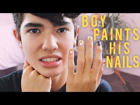 BOY PAINTS HIS NAILS