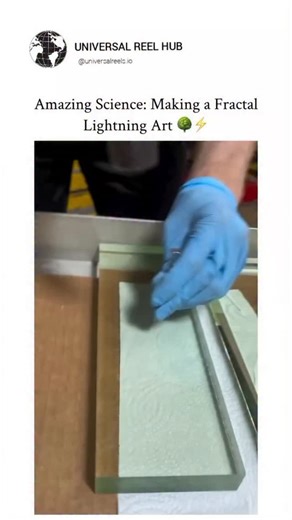 MEMES on Instagram: "This 10-second video demonstrates a beautiful, high-voltage physics phenomenon captured inside insulating material. The Setup: Two long, thick blocks of glass are placed on a table covered with tissue paper. The glass is likely charged with high-voltage electricity prior to the demonstration. - The Action: A person strikes the glass block using a hammer and a piece of metal. This strike causes a discharge of the stored electrical energy. The Result: When the glass cracks/dis