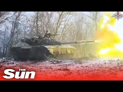 Russian T-80 armoured tanks fire at Ukrainian targets on winter battlefield