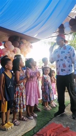 Children's Outdoor Celebration with Balloons and Fun