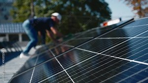 A chief engineer oversees the installation of solar panels on a rooftop. The scene highlights expert supervision and modern renewable energy solutions in action.