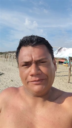 Beach Relaxation: Shirtless Male Enjoying the Ocean