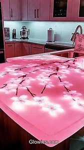These kitchen counters are super cool! They’re made with clear resin and have pretty cherry blossoms inside. The counters are shiny and smooth, and the flowers look like they’re blooming right in your kitchen.When it gets dark, the counters glow! The soft light makes the cherry blossoms shine, like magic flowers in the night. It makes the whole kitchen look like a glowing springtime dream! | Glow Lockets by Monique Lula