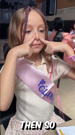 Mia is showing step by step how to make magic nose finger trick