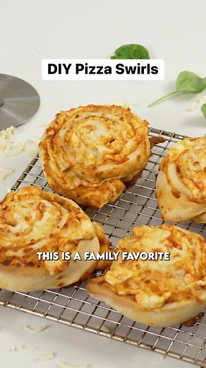 These Pizza Swirls are an incredible kid-friendly snack that is ready in under 10 minutes! Grab some homemade or store-bought pizza dough, roll it out into a rectangular shape, add on toppings, then roll up like a cinnamon bun, cut, and pop into the air fryer for 10 minutes at 400F. Done! These are so tasty, and you will just love them! | Andy’s East Coast Kitchen