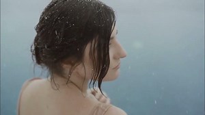Girl swimming in ice pool 4K Footage