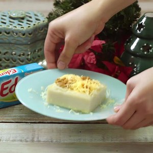 The perfect balance of sweet, salty, and creamy! Watch the video to learn how to make this melt in your mouth Cheesy Maja Blanca topped with Eden Meltsarap! | Eden Cheese