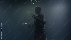 corpse of drowned man is keeping afloat underwater in sea, hands are swaying