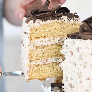 7.9K views · 391 reactions | Way faster and easier than it looks, this Southern Praline Cake is a winner the whole family will love. Its three layers of moist, brown sugar infused cake are covered in a nutty pecan buttercream frosting, and topped with dark chocolate curls. Your Sunday (and any day) needs this! Recipe here: https://bit.ly/2knCyRG | Imperial Sugar | Facebook