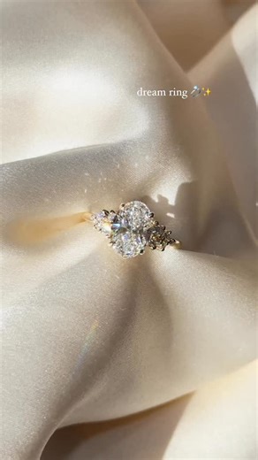 The ring from your Pinterest board, come to life. ✨💍 The one that makes your heart skip a beat every time you picture it. Stunning oval engagement ring with star-like side diamonds that make the center stone glow from every angle. Ring Details 💫 • Setting: Nova • Metal: 14kt Yellow Gold • Band Width: 1.6mm • Center Stone: 2.00ct Oval Lab Diamond • Color: D | Clarity: VS1 • Price: $3,854 💍 Try it on IRL at our Huntington Beach showroom 🌊 🛠️ Custom designs? Text us → 714.899.1122 🛍️ Shop now