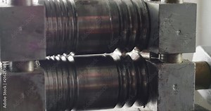 Close up of a machine that works the steel, iron and gold to make rings and jewelry in general. Concept: Industrial, goldsmith, silver