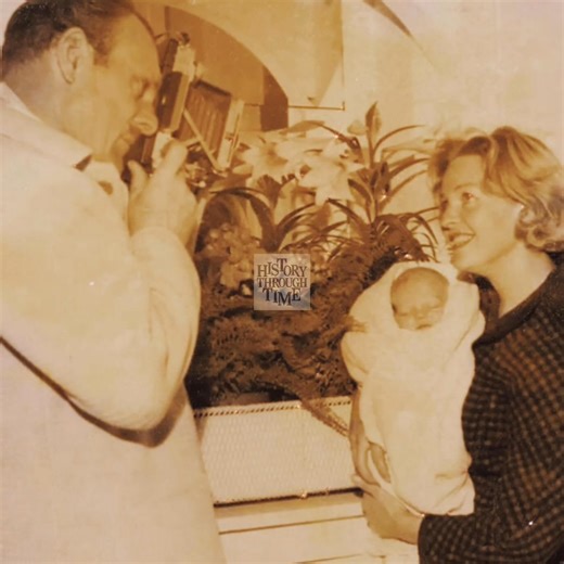 "Circa 1964, British actor Terry-Thomas and his second wife, Belinda Cunningham, were photographed at their London home with their newborn son, Timothy. Terry-Thomas, already beloved for his comedic roles in films such as I’m All Right Jack (1959) and It’s a Mad, Mad, Mad, Mad World (1963), appeared beaming with pride as he embraced fatherhood once again. Belinda, radiant and graceful, added warmth to the family portrait, holding baby Timothy close. The intimate setting highlighted a tender chap
