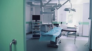 Interior of operating room in modern clinic. Hospital details.