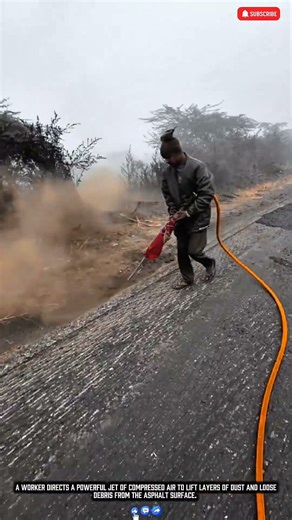 High Pressure Air Blower Blasts Dust Off Road Surface