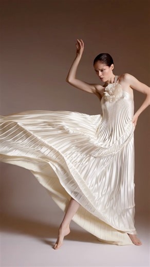 Some pieces aren’t designed to be rushed… they’re created to be cherished. 🤍✨ Pleated by 5th generation atelier @internationalpleating and adorned with a custom flower from @customfabricflowers - a century-old family studio in New York. This dress is crafted the old-world way, with heart and expertise. 🧵 💙 The Angel Dress is Max’s debut atelier-produced gown, made for you, one at a time in New York. Details for collectors are on our site. …. 📸 Jeanie Stehr 💃🏻 @cocorocha @cocorochamodelcamp