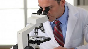 Scientist Looks Into Microscope Stock Footage Video (100% Royalty-free) 4588793 | Shutterstock