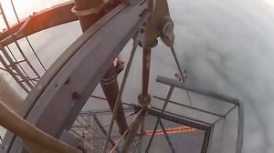 Livestream of man scaling 1,999ft tower to change a light bulb isn't what it seems
