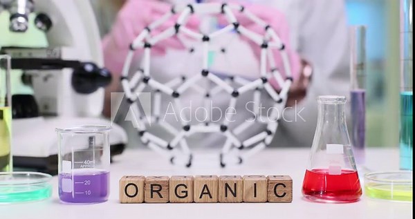 Explore organic chemistry using vibrant solutions and complex molecular models in a lab environment