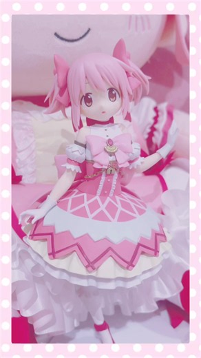 to my excitement , a new walpurgis no kaiten madoka figure was released ! her little curious face is just too cute …. this design is absolutely incredible in my opinion. the colours just blend together so well , looking so pleasant on madoka. her off shoulder sleeves are especially lovely ! the sharper angles on this design do not scream madoka but i think that is the point. homura has stripped madoka of her wish , it only makes sense that her design would reflect homura closer than herself. the