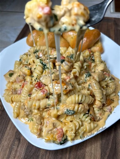 Creamy Rotel Chicken Pasta Bake Spice up your pasta night with this unbelievably creamy, cheesy Rotel Chicken Pasta. It's the one-pan wonder where zesty tomatoes and green chiles meet a velvety cream sauce for the ultimate comfort food pasta experience. Ingredients For the Pasta and Chicken: 1 pound penne pasta 2 large chicken breasts, boneless and skinless, cut into 1-inch pieces 1 tablespoon olive oil 1 teaspoon chili powder 1/2 teaspoon cumin Salt and black pepper to taste For the Creamy Rote