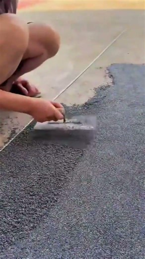 Manually Cutting Asphalt Surface Using Hand Scraper Tool Safely