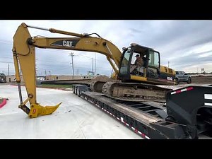 Side loading the 320 Cat excavator on the RGN trailer