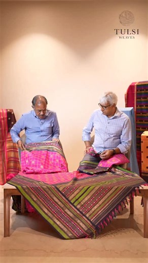 Tulsi Weaves on Instagram: "Tulsi Vintage 32 Woven between 45–50 years ago, this saree is defined by a wide eight-inch border carrying lotus motifs, paired with a soft pink body. The checked field is worked in three-colour seer, punctuated with round motifs that lend quiet rhythm to the weave. A composition that reflects the scale and confidence of its time. #TulsiVintage #ArchivalSaree #LotusBorder #EightInchBorder #SeerWeave CheckedBody VintageWeaves HandloomHeritage SareeArchive"