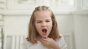 little girl yawns. can't Wake up.