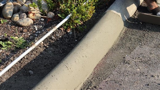 🎊#DNVstories Year in Review Our DNV curb-making crew typically handles 50-60 metres of concrete per day—roughly equivalent to the length of an Olympic-sized swimming pool. Affectionately referred to as the "spaghetti machine," its technical name is an extruded curb machine. It creates continuous concrete curbs along roads, parking lots, and other paved areas to help make streets safer. Beyond the surface of day-to-day District life, there’s more than meets the eye. ➡️Learn more: https://bit.ly/