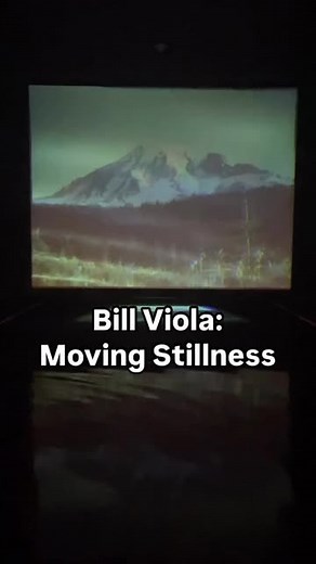 Hudson River Museum on Instagram: "Experience “Bill Viola: Moving Stillness,” a mesmerizing video installation by artist #BillViola, a pioneer of video and installation art. Shown in a darkened room, the installation features a calm pool of water reflecting a projected video of #MountRainier, an active volcano in #Washington State. The serene beauty of the landscape is the latent power for sudden, violent change, expressing nature’s cycles of renewal. You have to experience this contemplative an