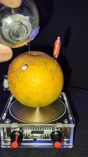 Orange bulb vs Tesla coil experiment video#experiment #viral #nikolatesla #music #satisfying #shorts