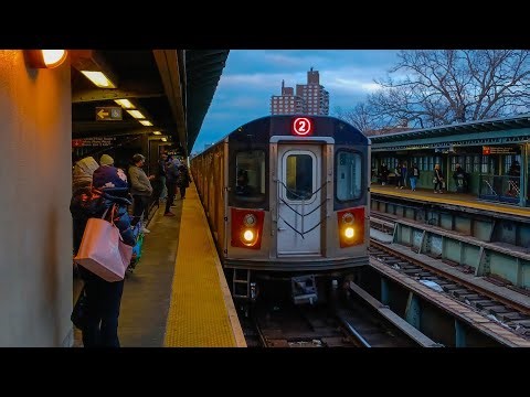 R142 (2) train action pulls up at Pelham Parkway