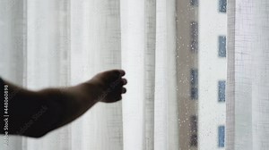 Open the sheer curtains on the large window. while it's raining 4k