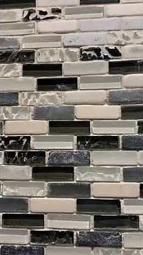 Remove excess grout from tile surface by wet sanding