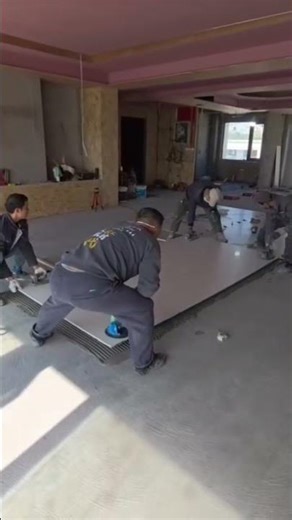 Using a miniature power file tool for quick and precise smoothing of a wooden corner.