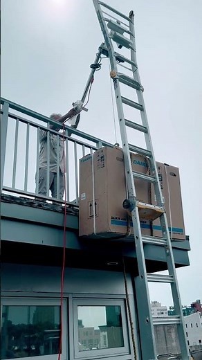 How can a single worker lift a condenser onto a roof?