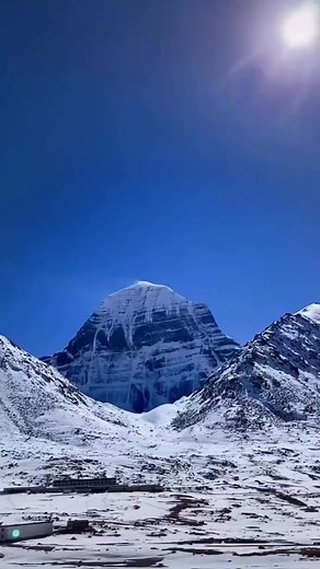 📍 Mount Kailash 🙏 A great mass of black rock soaring to over 22,000 feet, Mt. Kailash has the unique distinction of being the world's most venerated holy place at the same time that it is the least visited. The supremely sacred site of four religions and billions of people, Kailash is seen by no more than a few thousand pilgrims each year. This curious fact is explained by the mountain's remote location in far western Tibet. No planes, trains or buses journey anywhere near the region and even 