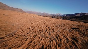 Flight speed over autumn mountain valley picturesque rocky landscape. Panorama, speed, aerial view. Sports drone with first person view, landscapes with rocks blue sky horizon 4k